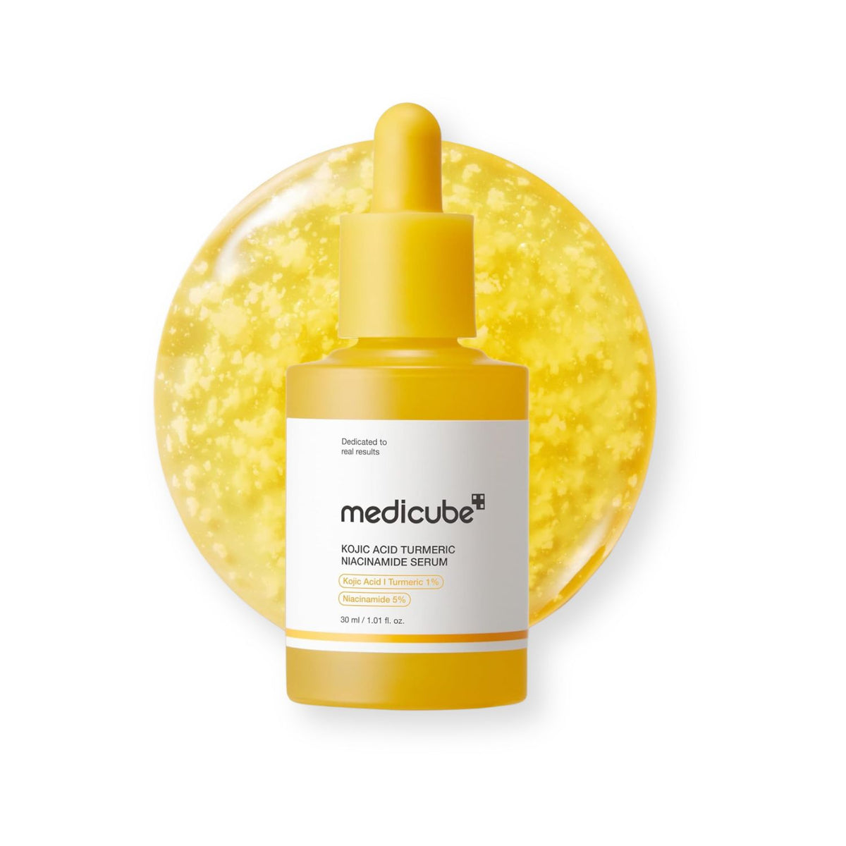 A bottle of medicube Kojic Acid Turmeric Niacinamide Serum in a vibrant yellow color, featuring a white label with black text and a yellow dropper cap. The bottle is centered in front of a textured, glittery yellow circular background on a solid white studio backdrop.