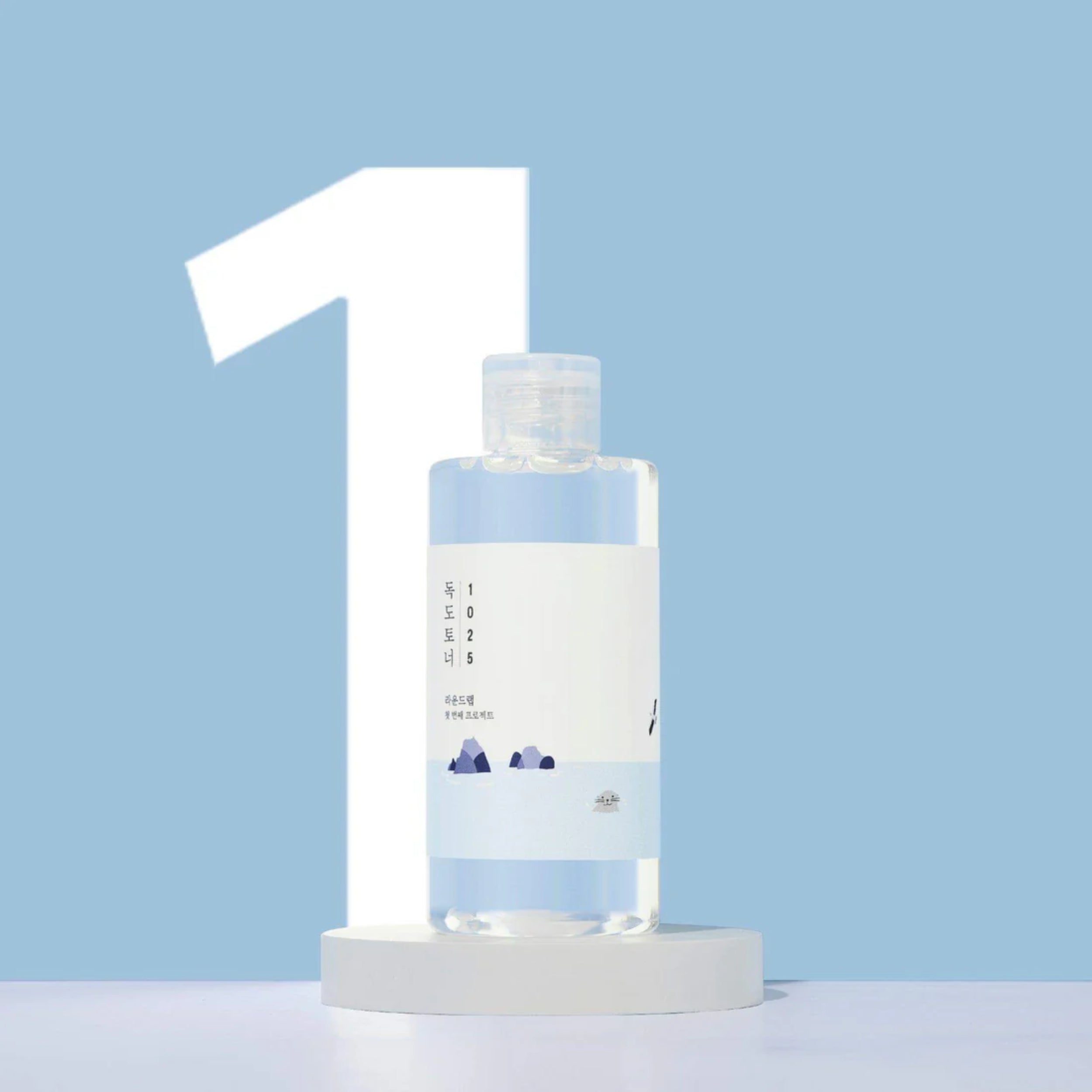 Clear bottle with a white label on a light blue background