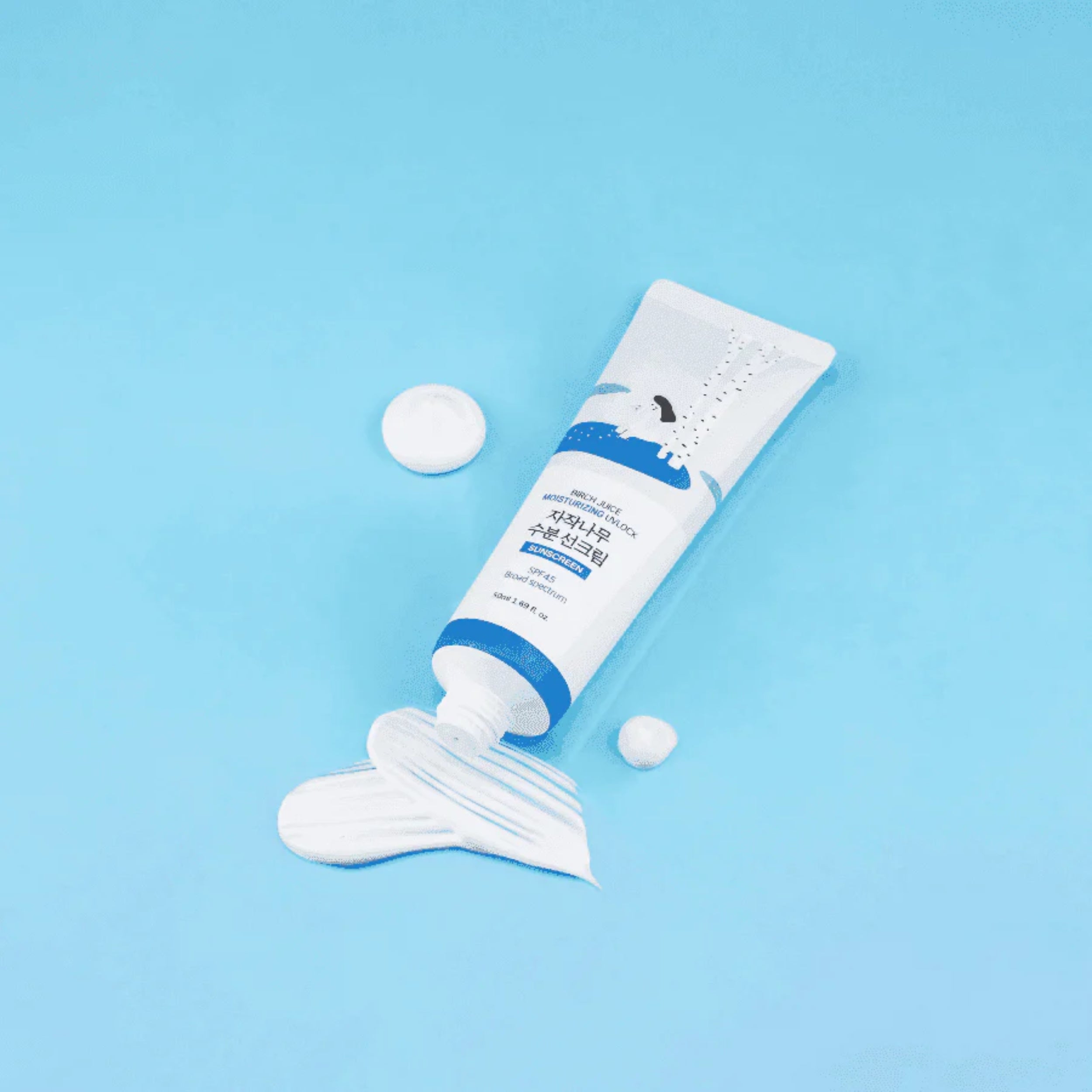 Tube of white cream with blue label on a light blue background