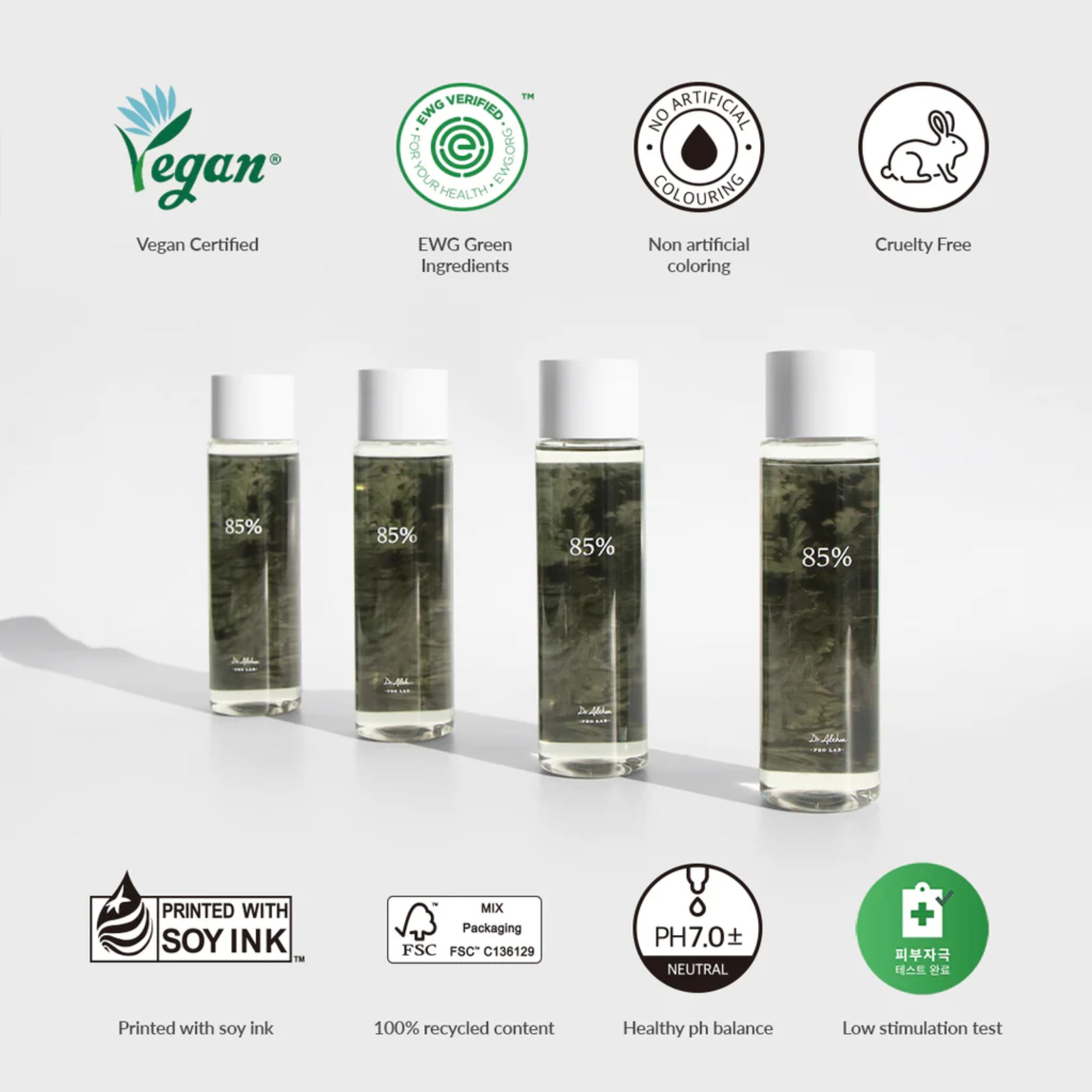 Four bottles of skincare product with certification logos on a white background