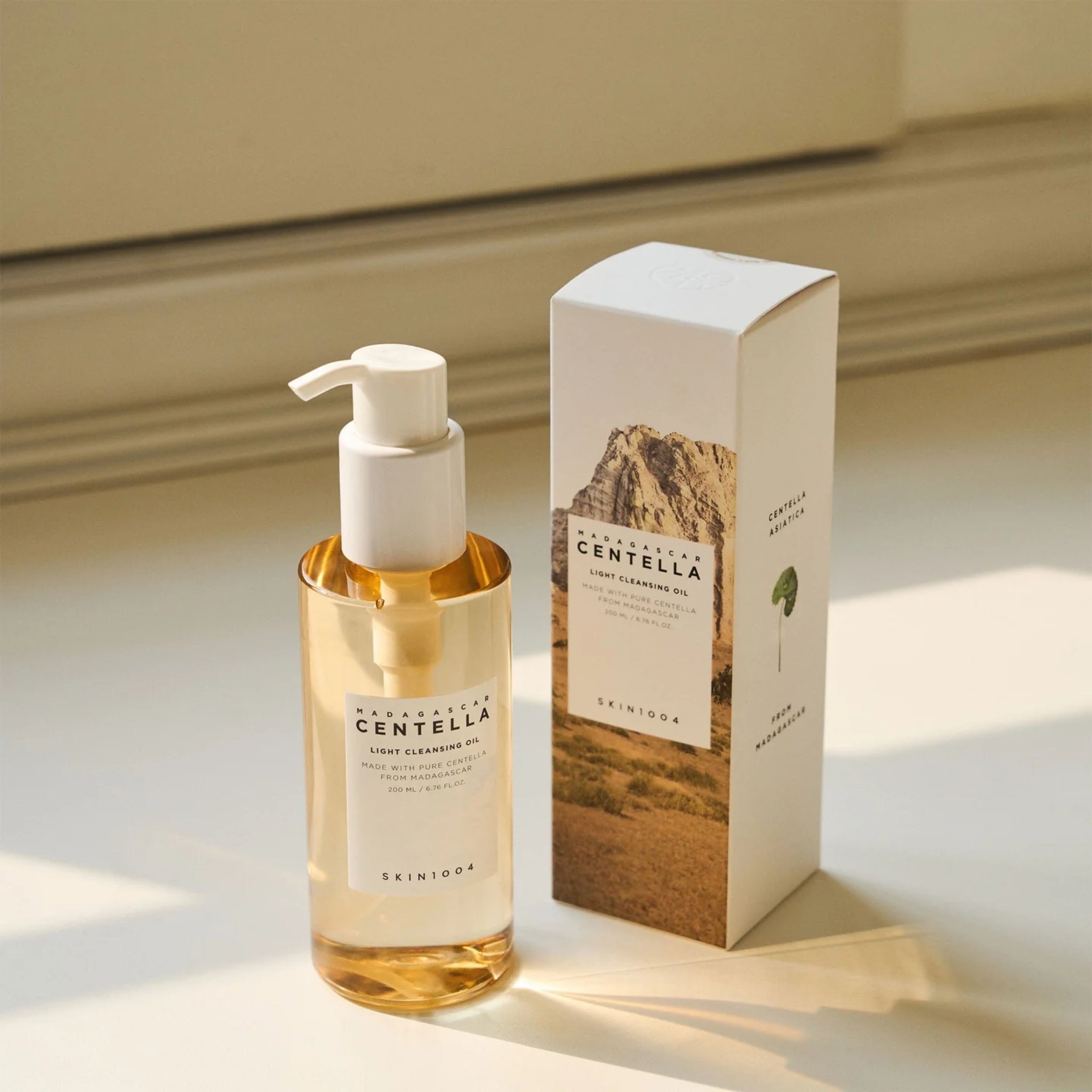 Skincare bottle and packaging on a neutral background