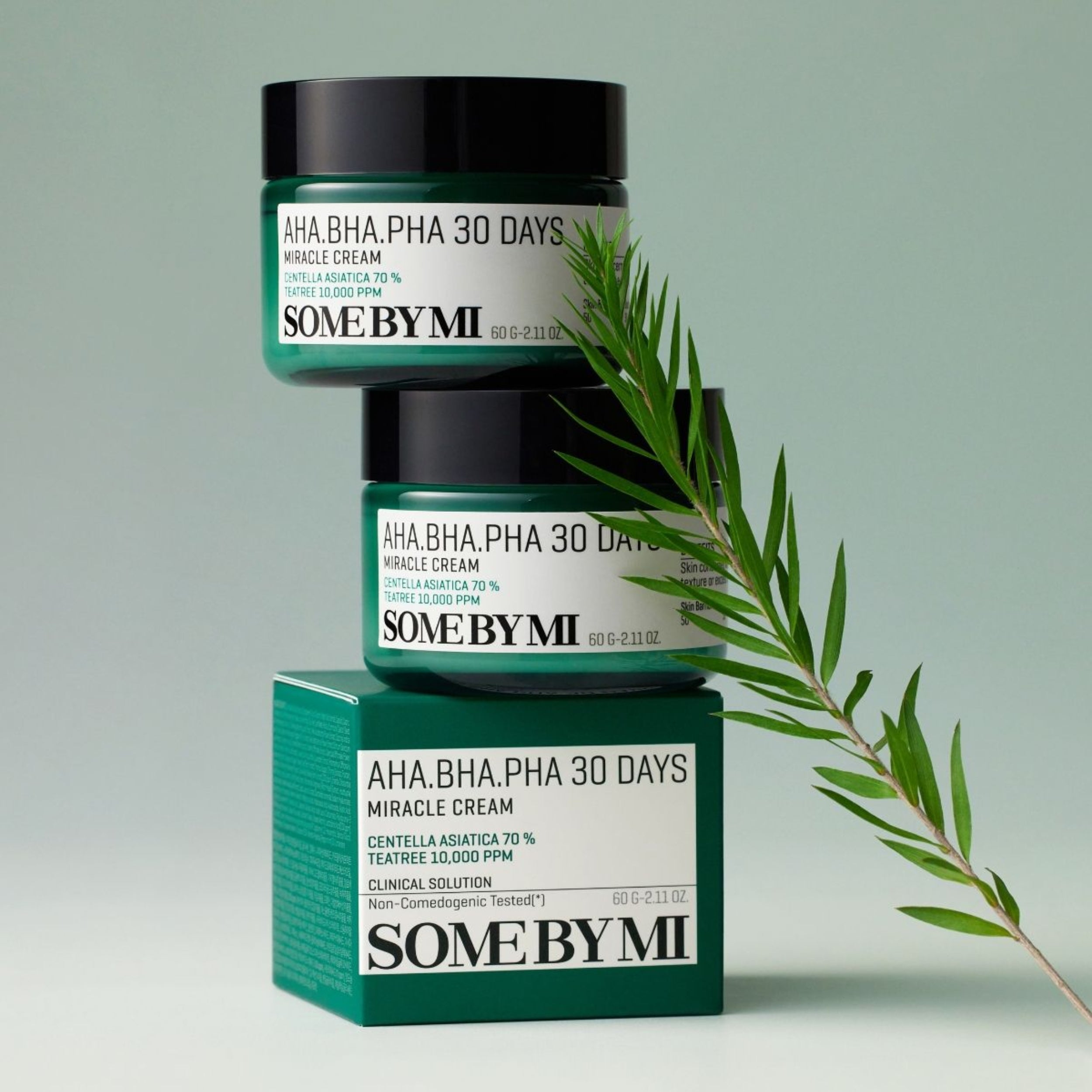 SOME BY MI AHA BHA PHA 30 Days Miracle Cream with packaging and a green leaf on a light green background