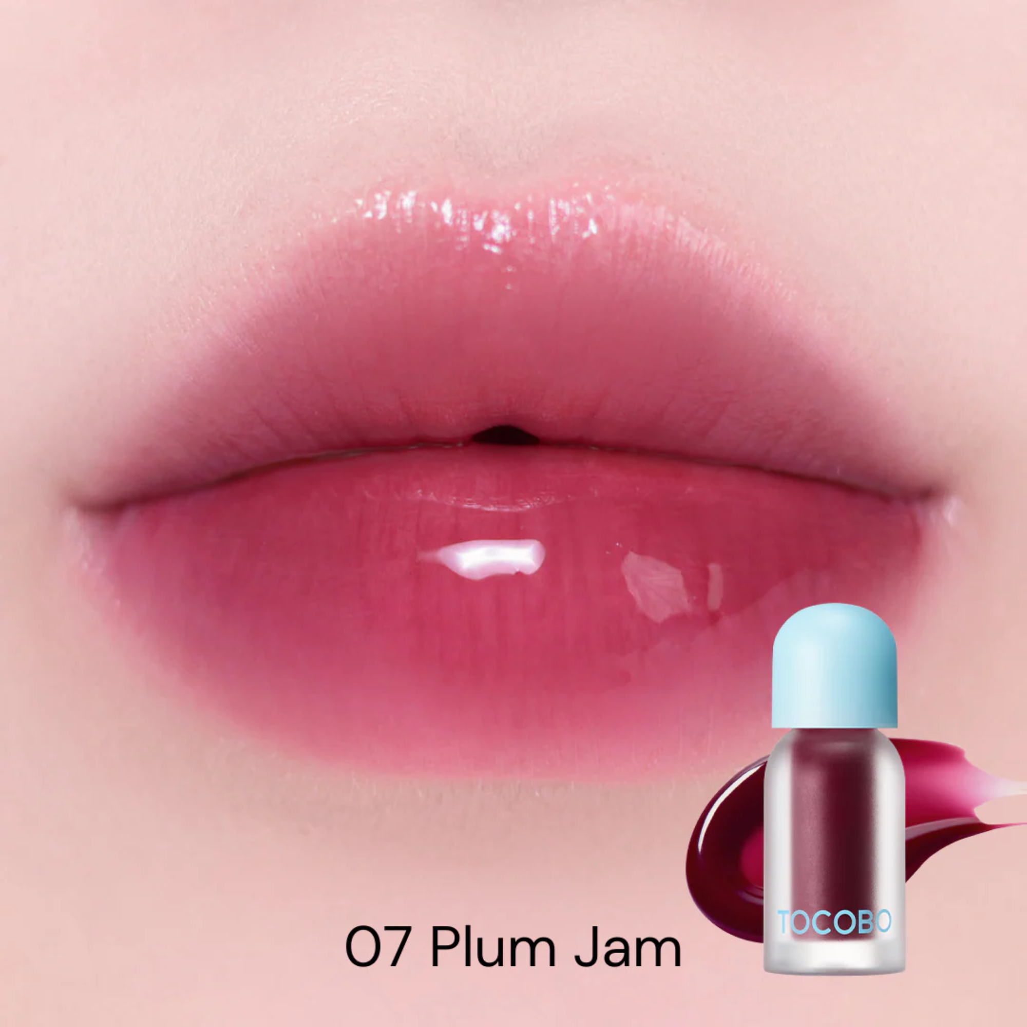 Lip with '07 Plum Jam' lipstick application and Tocoto brand bottle on a light pink background