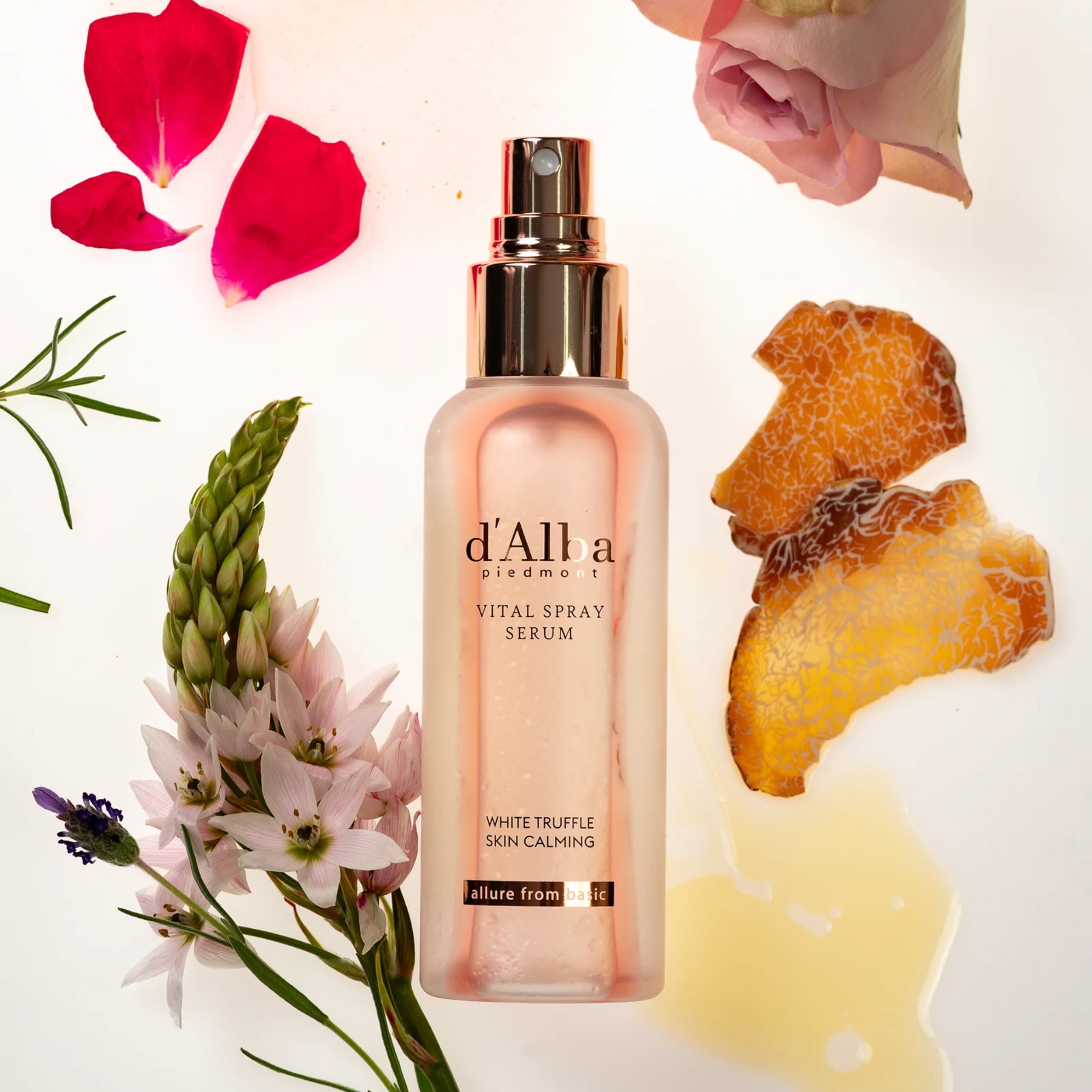 d'Alba vital spray serum bottle with flowers and ingredients on a white background