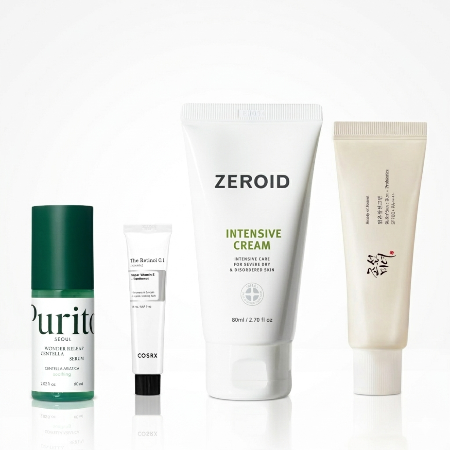 Four skincare products from different brands on a white background